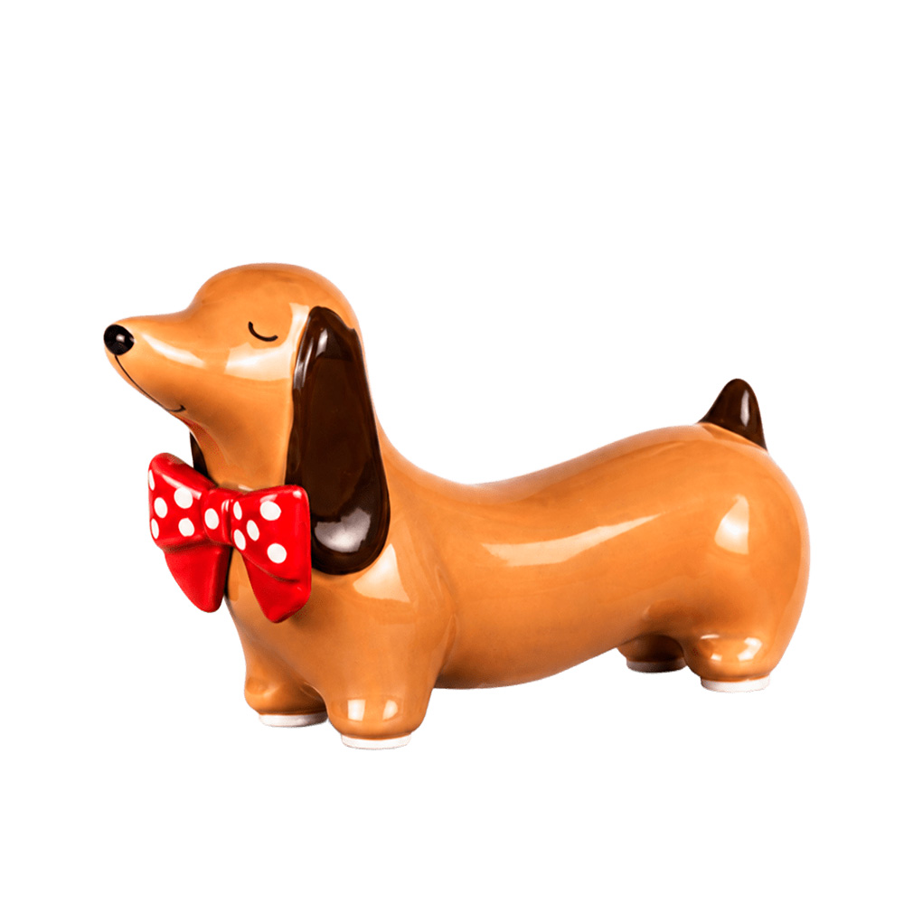 Perro salchicha con mo&ntilde;a (porcelana)